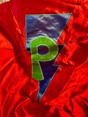 Red Satin Cape with Blue Lightning and Green 'P' Emblem